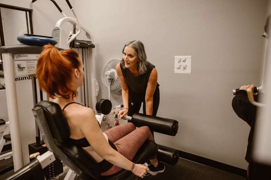 A personal trainer guiding women during a workout session in a gym setting.perimenopause symptoms